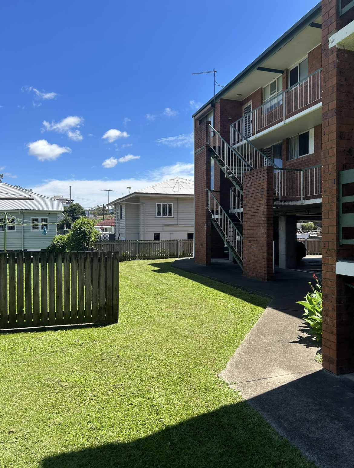 Lawn mowing at residential apartment complex - Brisbane